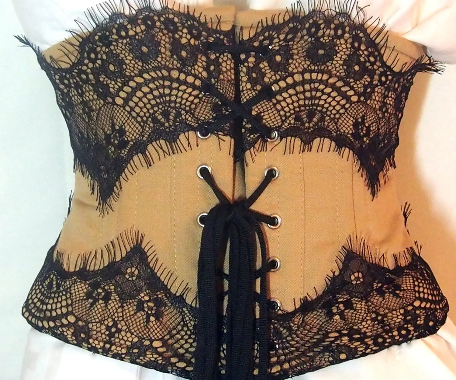 Exclusive corset covered by laces. Lace Addicted Corsettery collection of waist training corsets. Gothic, steampunk, waist training waspie