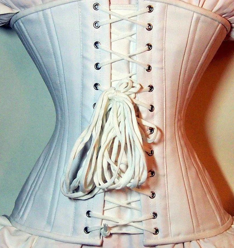 Exclusive white bridal steel-boned corset for tight lacing covered by laces. Lace Addicted Corsettery collection. Wedding, bridal corset