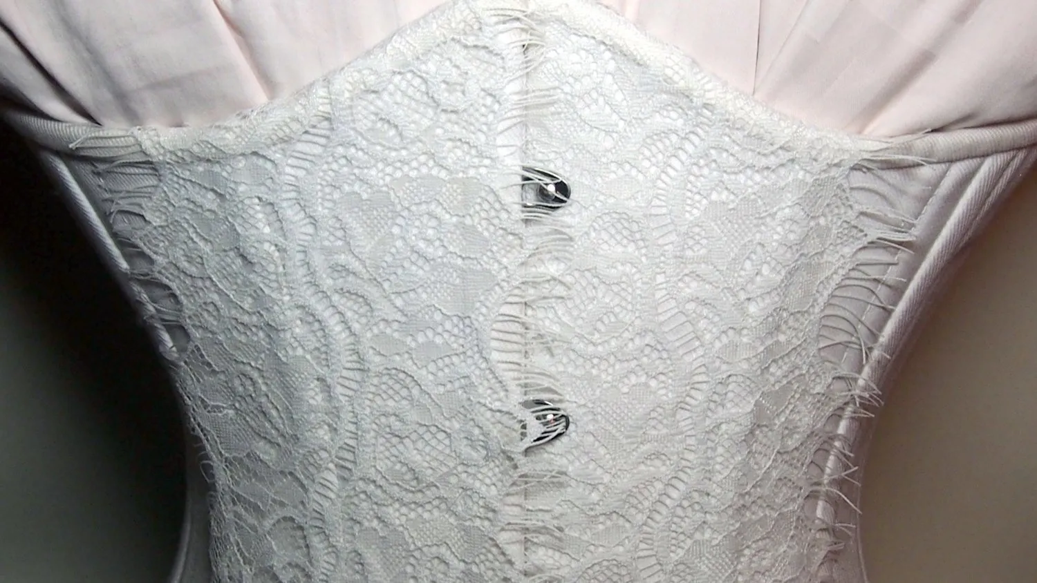 Exclusive white bridal steel-boned corset for tight lacing covered by laces. Lace Addicted Corsettery collection. Wedding, bridal corset