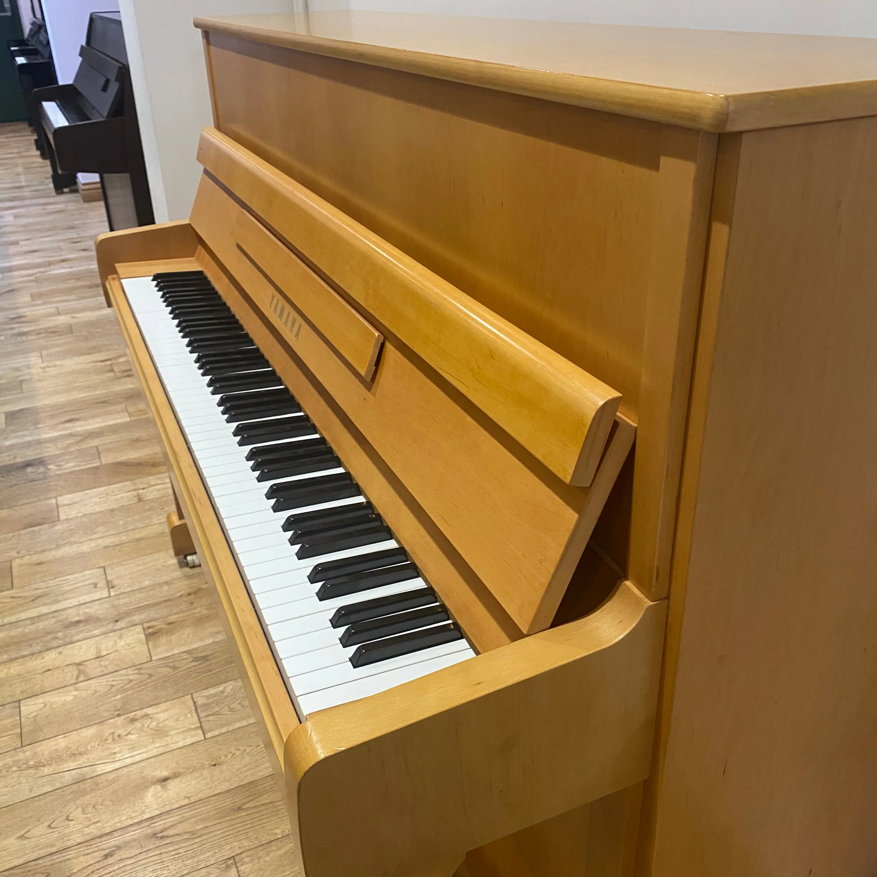 Pre-owned Yamaha P116 upright piano in satin alder