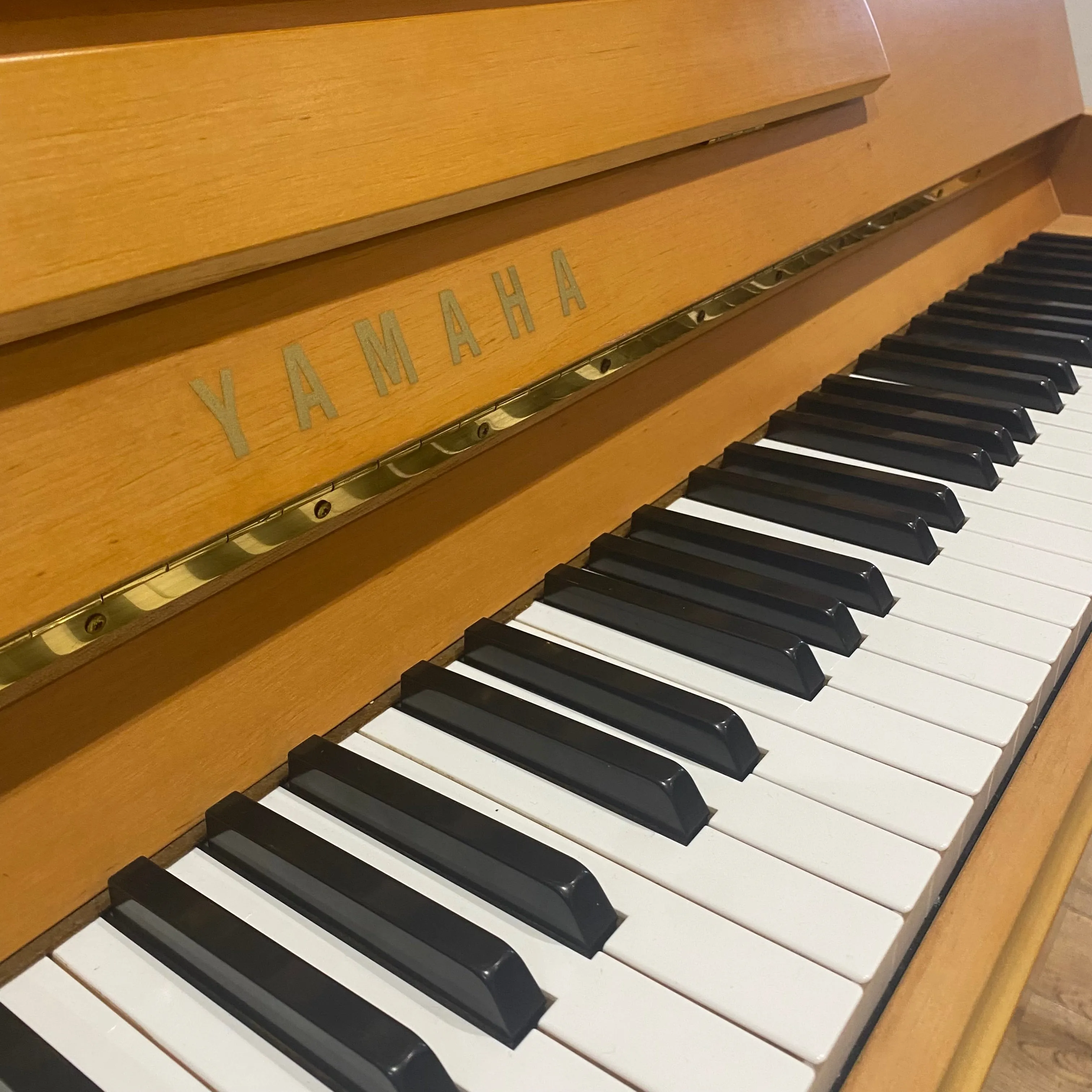 Pre-owned Yamaha P116 upright piano in satin alder